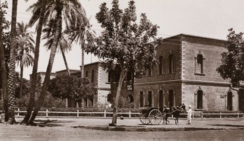 Post Office in Khartoum. Exterior view of the Post Office in Khartoum. A Sudanese man with a horse