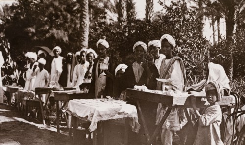 Street traders selling silverware, Khartoum. A line of Sudanese street traders, many of them