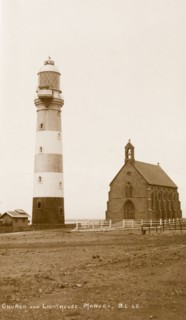 Manora Point lighthouse and St. Paul's Church. View of Manora Point lighthouse and St. Paul's
