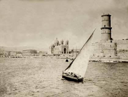 Vieux Port, Marseille. A small boat sails near to the entrance of Vieux Port at Marseille. The