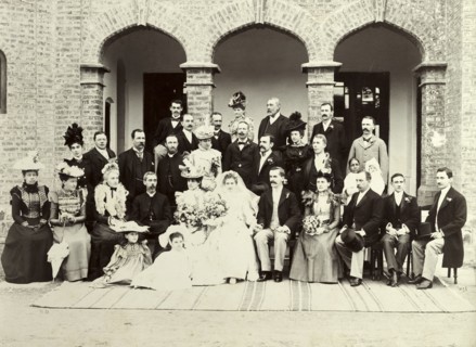 A British wedding in India, 1899. A newly-wed British couple pose for a group portrait with their