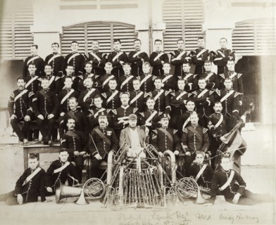 British Army military band with instruments. A British Army military band pose for a group