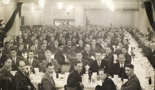 Colonial Police Force dinner, 1954. A large group of British men attend a formal dinner and award