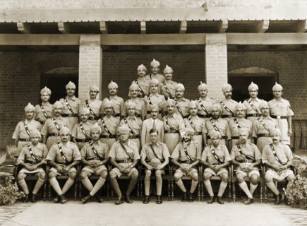 Jhelum Police, 1938. Uniformed ranking officers of the Jhelum Police pose for a group portrait to