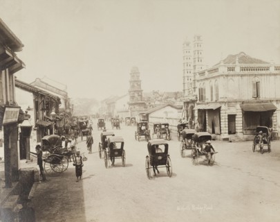 Rickshaws on South Bridge Road, Singapore. Rickshaws travel back and forth along Singapore's South
