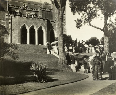 New Year's garden party at Government House, Perth. Formally dressed guests socialise in the