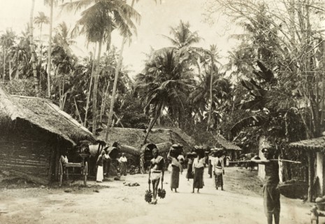 Street scene in Ceylon. Street scene in Ceylon (Sri Lanka). Several people walk to and fro along a