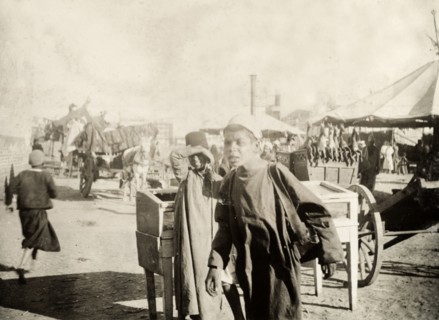 North African boys at an outdoor bazaar. Two north African boys, pictured at an outdoor bazaar.