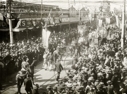 Royal parade through China Town, Perth. Crowds of spectators line the streets in Perth's China Town