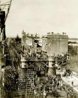 Royal procession beneath the Coach Arch. A procession for the Duke and Duchess of Cornwall and York