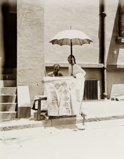 Letter-writing service on a Hong Kong street. A street trader offering a letter-writing service