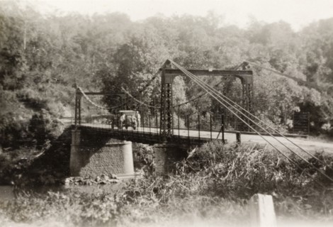 Tahsai Bridge in Shan State. View of a motorcar parked on Tahsai suspension bridge over the Salween