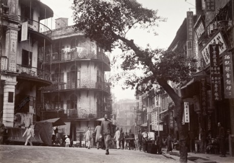 Junction of Queen's Road and Jervois Street, Hong Kong. Street traders sell their wares to