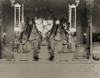 Statues of deities inside a Chinese Joss house. The statues of two Chinese deities ('Joss'),