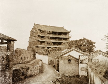 A five-storey pagoda in Canton. A five-storey pagoda stands beside the ruins of an old city wall.