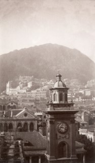 A clock tower in Hong Kong. View over Hong Kong looking south, featuring a prominent clock tower,