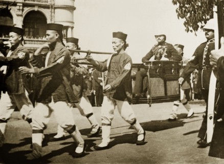 The Duke of Connaught visits Hong Kong, 1906. A team of Chinese bearers, wearing a uniform of