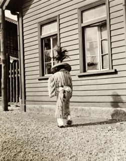 Traditional Japanese dress. A person (probably male) dressed in traditional Japanese costume, walks
