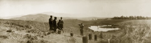African women collecting water, South Africa. Five African women stand by pots placed on the