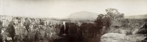 Sabie River waterfall. A view of a cliff along the Sabi River, with a waterfall cascading over the