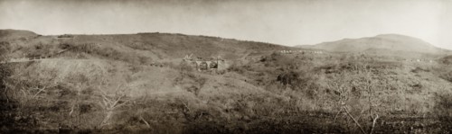Construction of a bridge, South Africa. Three horsemen ride down to a ford to view the construction
