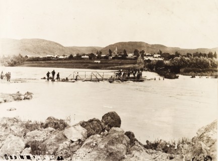 Flooding in Heidelberg. A footbridge is partially submerged in the swollen waters of the Biesbok