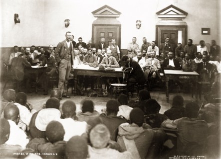 A Matabele indaba with Captain Lawley. British colonial officer, Mr W. Thomas, addresses an