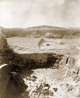Labourers at Westernberg Mine. Labourers work at the bottom of Westernberg Mine, a large, open-pit