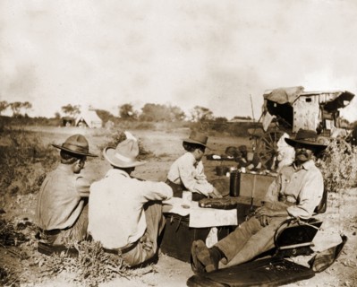 Captain Lawley relaxes in camp. Captain Arthur Lawley (1860-1932) (front right) rests with fellow