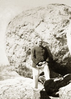 Cecil Rhodes at the Matopos Hills. Cecil Rhodes (1853-1902) stands amongst the granite boulders of