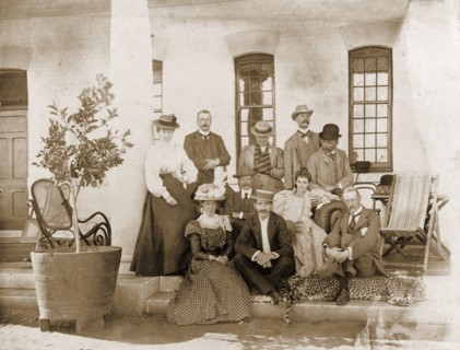 Guests at Government House in Bulawayo. A group of British administrators and their wives pose for