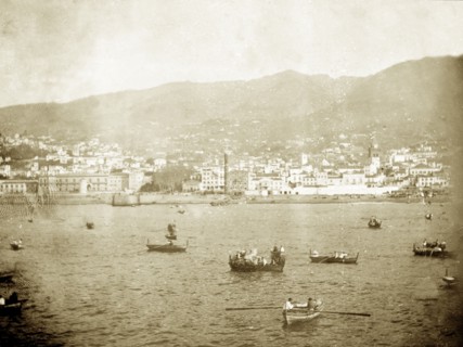 Funchal Bay, Madeira. Rowing boats bob about in Funchal Bay near to the coastal city of Funchal.