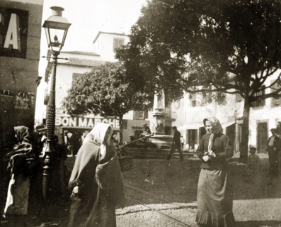 A town square in Madeira. Tramlines run through a busy town square in Funchal, which is flanked by