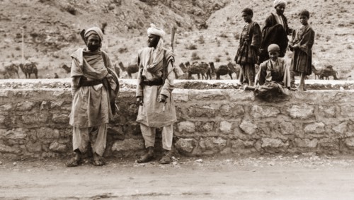 Armed frontier guards. Two armed guards, identified as 'Frontier Constabulary' officers, stand