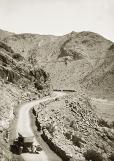Near the site of Mollie Ellis' abduction. A motorcar pauses on a winding mountain road near the