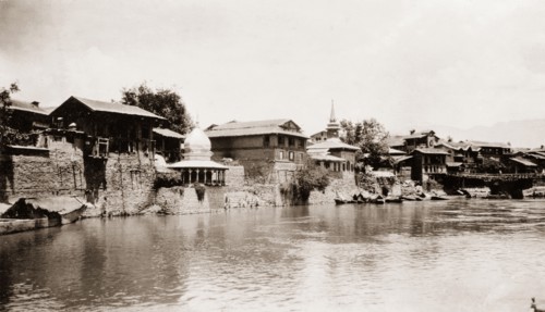 The Jhelum River at Srinagar. Tightly packed buildings flank the Jhelum River as it passes through