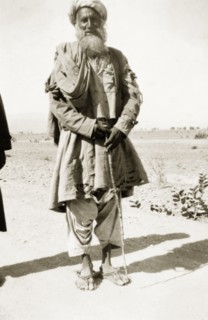 An elderly Afridi man. Full-length portrait of an elderly Afridi man, dressed in traditional