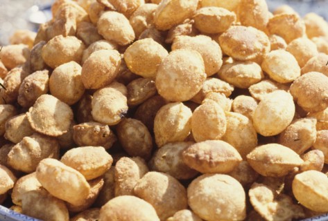 A heap of freshly cooked puris. A heap of freshly cooked puris, on display at an outdoor market. A