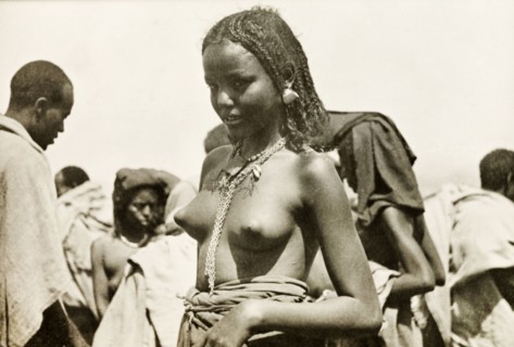 A young Eritrean woman. Portrait of a young Eritrean woman, taken at an outdoor camel market. Naked