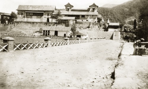 Palatial residence in northern India. View down a driveway, looking towards the rear of a large,