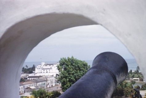 Elmina Castle from Fort St Jago. Distant view of Elmina Castle, taken through a cannon hole at Fort