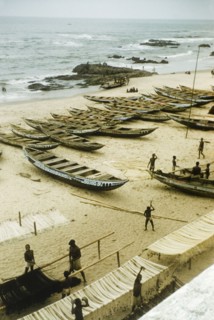 Fishing beach at Anomabu. A beach at Anomabu, covered with painted fishing boats and rows of