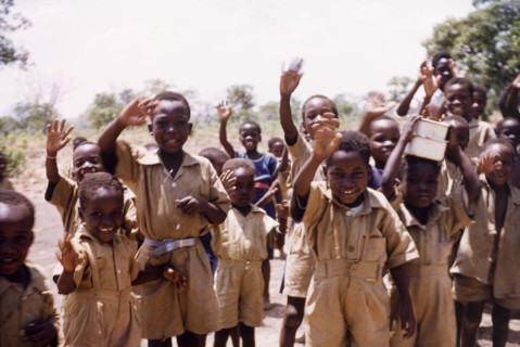 Ghanaian schoolboys wave goodbye. A group of uniformed schoolboys wave goodbye. Pong-Tamale, Ghana,