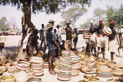 Baskets at Bolgatanga market. Ghanaian policemen haggle over the price of baskets at Bolgatanga