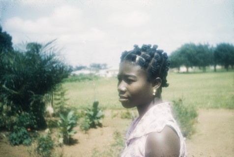Ghanaian woman with a traditional hairstyle. Profile portrait of a Ghanaian woman wearing a