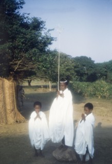 Children dressed as angels. Portrait of three children, dressed in white angel costumes for a