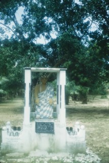 Commemorative monument at Saltpond. A commemorative roadside monument features a painted sculpture