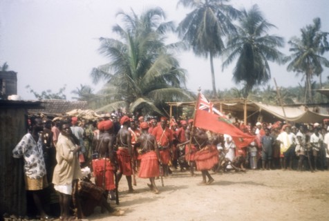 Flag dance of Asafo Number Two Company. A 'frankakitanyi' (flag dancer) swings the flag at the