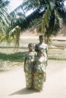 Ghanaian girls in kente cloth. Portrait of three Ghanaian girls dressed in outfits made from