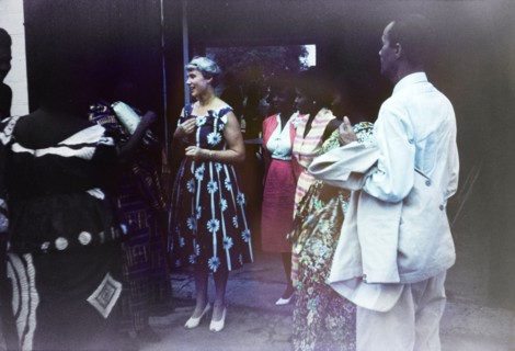 Wilma Gladstone's farewell party. A European woman chats to a group of Ghanaian friends at a